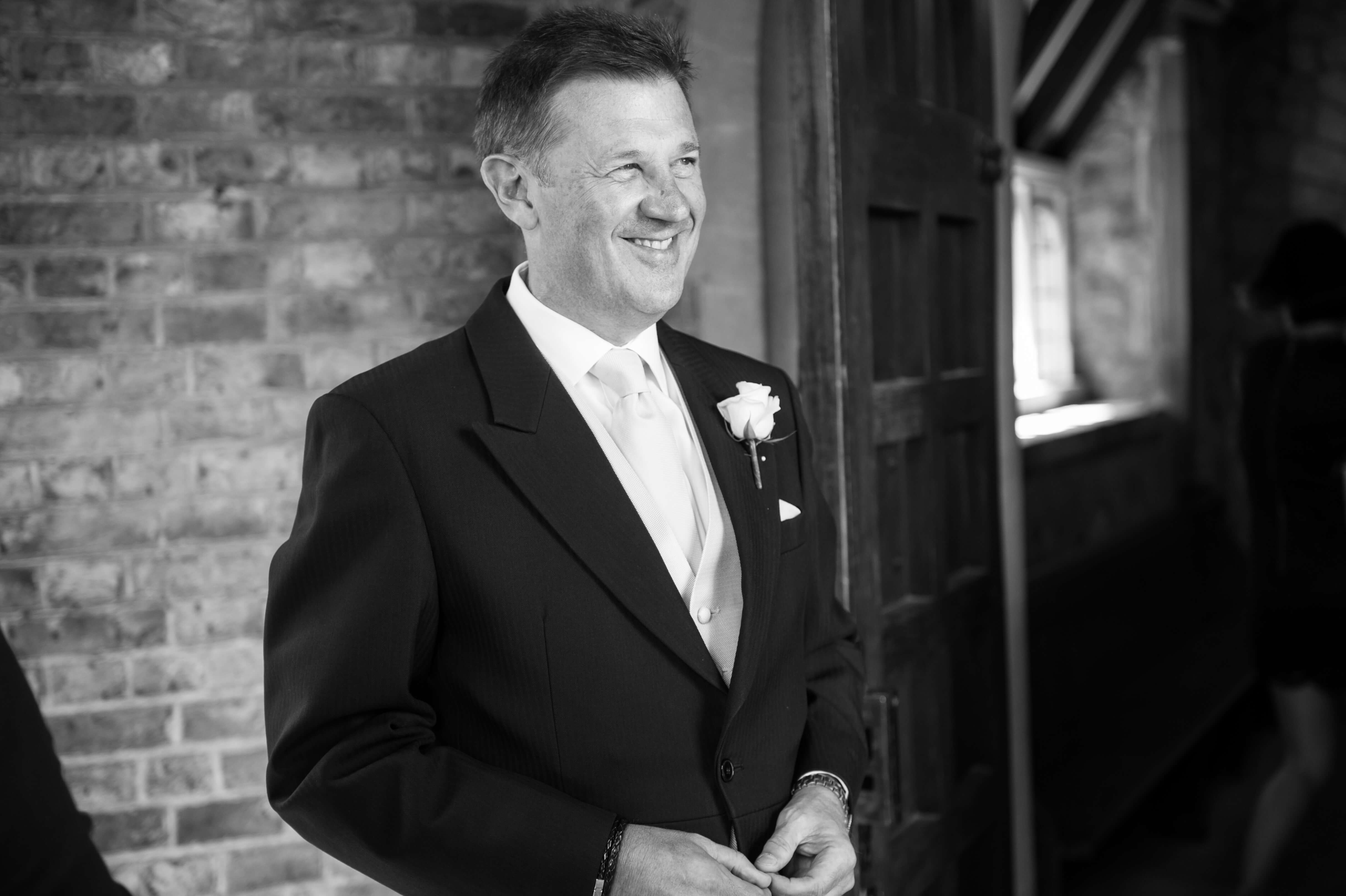father of the bride waiting at the church door by especially amy wedding photography